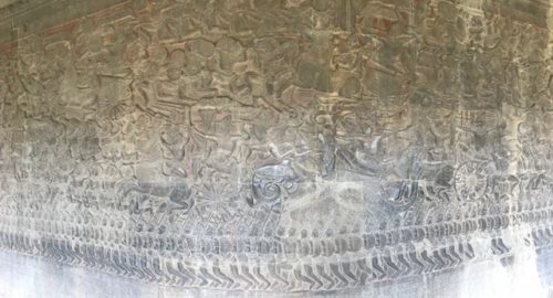 a stone carving of a battle scene