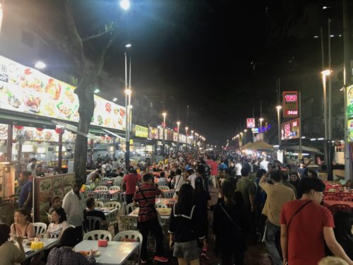 a crowd of people at a street food festival