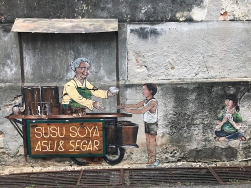 a mural of a woman and a boy