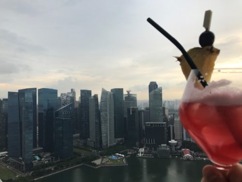 a drink with a city in the background