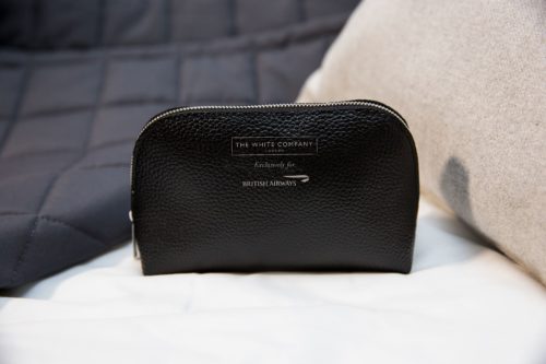 a black leather pouch on a white surface