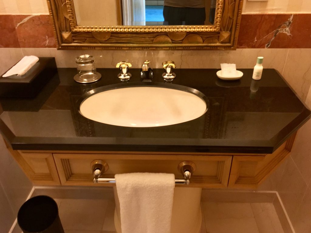 a bathroom sink with a mirror and a mirror