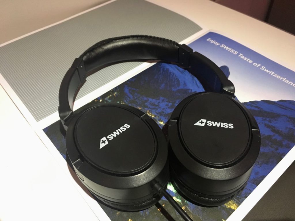 a pair of black headphones on a book