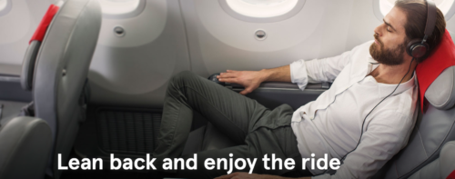 a man lying on an airplane