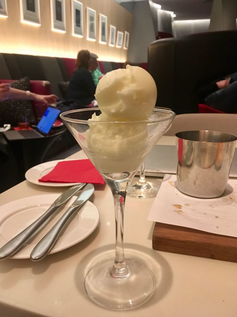a glass with a scoop of ice cream in it
