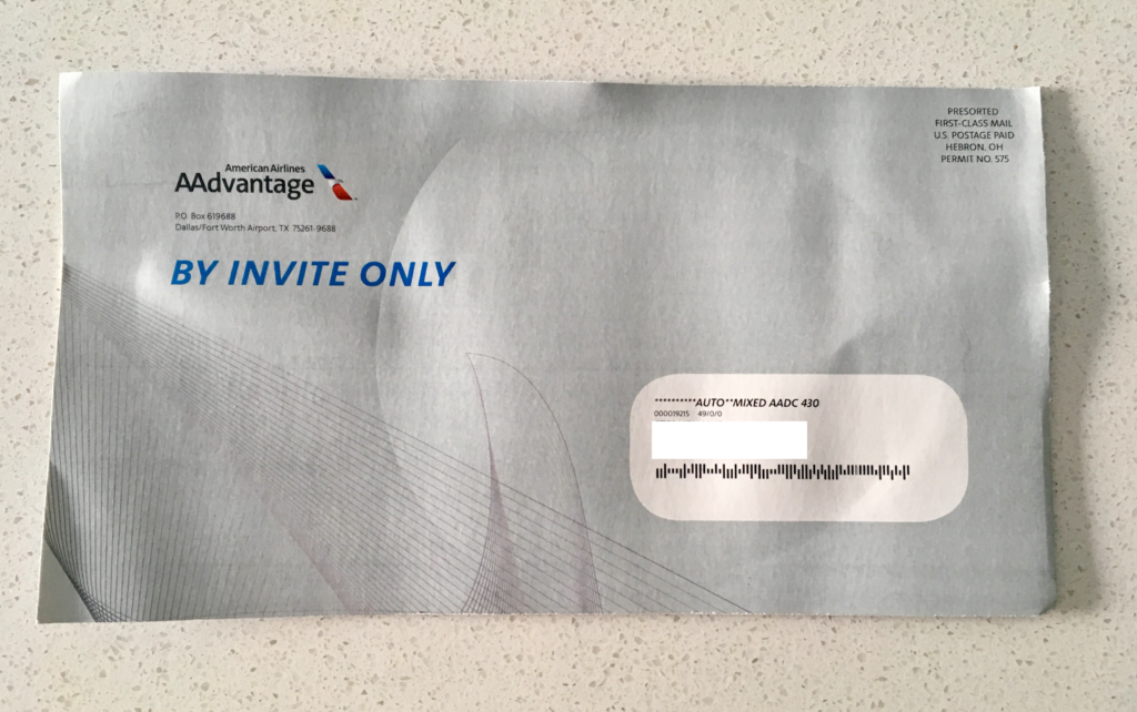 a envelope with a black barcode and blue text
