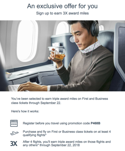 a man sitting in an airplane holding a drink