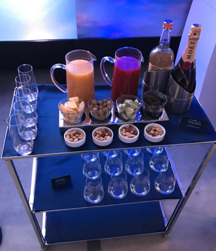 a table with glasses and drinks on it
