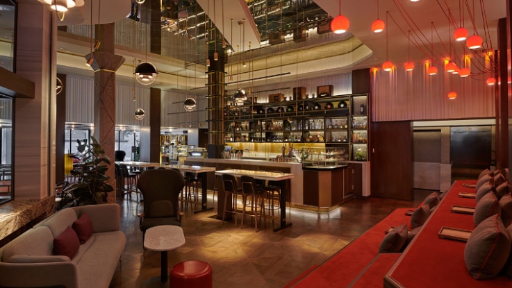 The bar at the Hyatt Centric Madrid is an open, warm space that was altered from the original design.