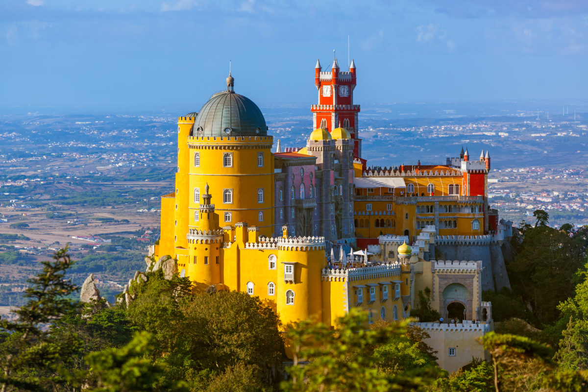 Sintra's Pena Palace is a popular day trip from Lisbon. It was inspired by Bavaria's Neuschwanstein Castle, but the colors are much more reminiscent of Spain's Antonio Gaudi.
