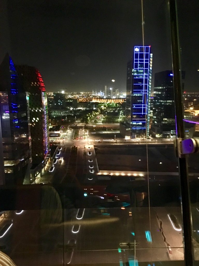a city at night seen through a window