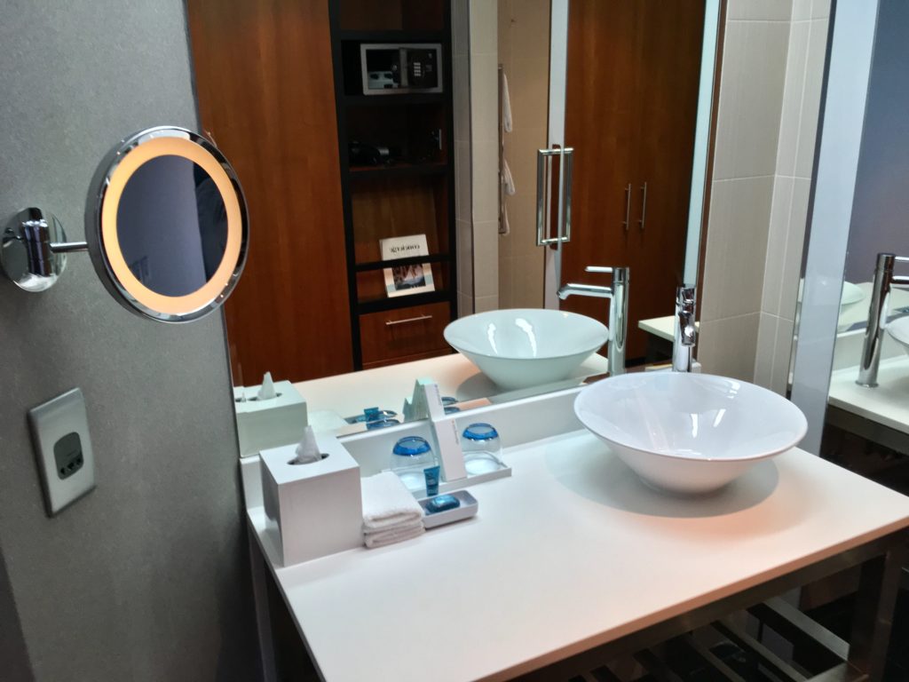 a bathroom with a sink and mirror
