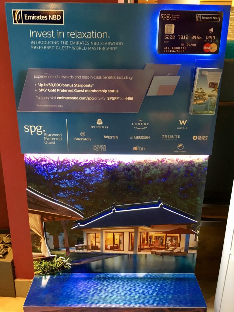 a sign with a picture of a house and credit card