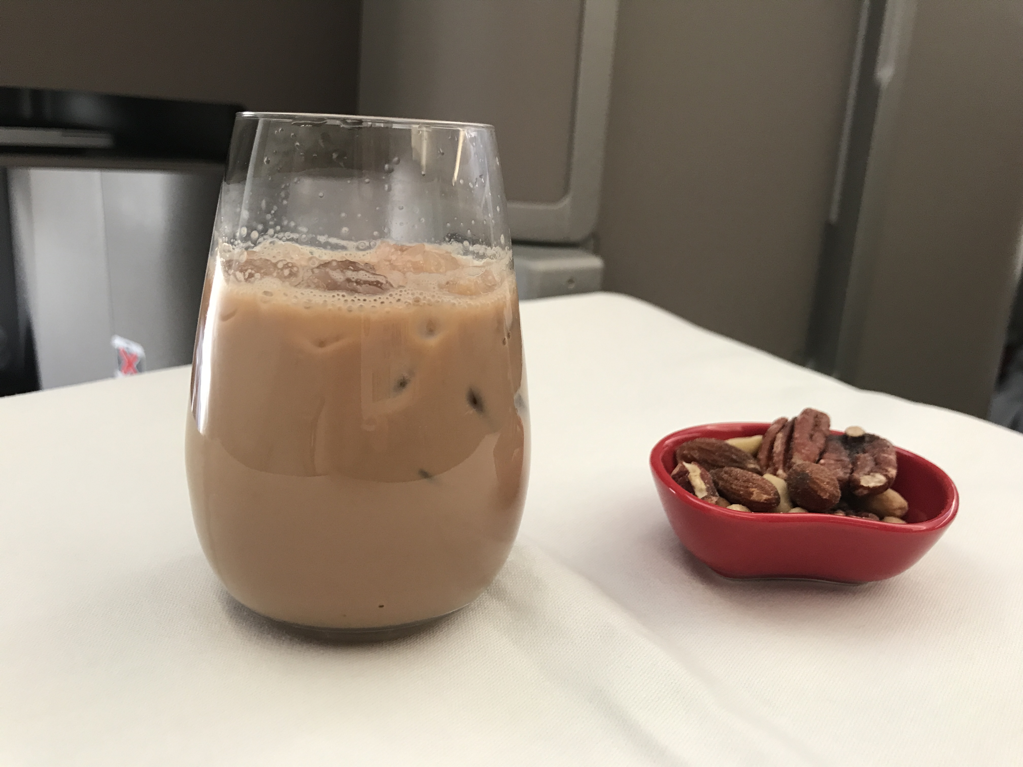 Nuts and iced milk tea to start things off. | Image by Chris Dong