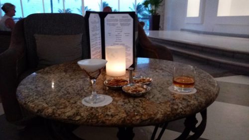 a table with drinks and menu