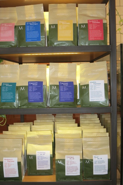 several bags of coffee on a shelf
