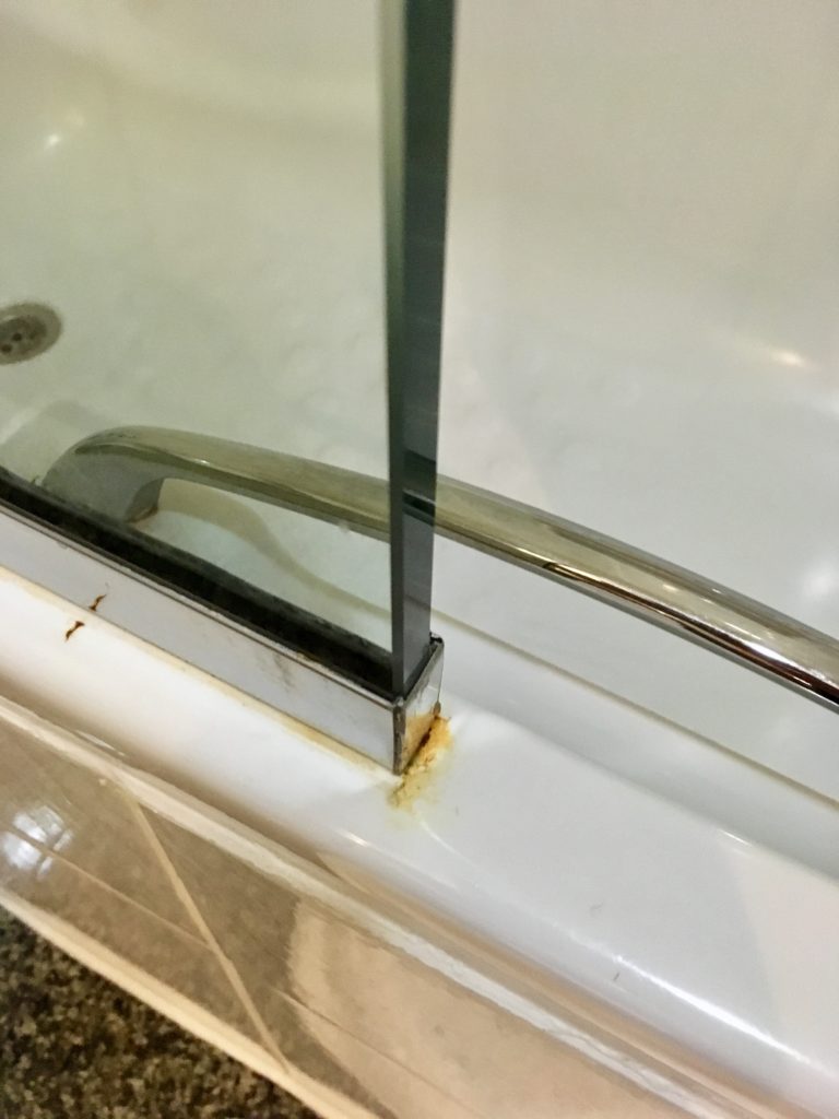 a rust on a glass shower door