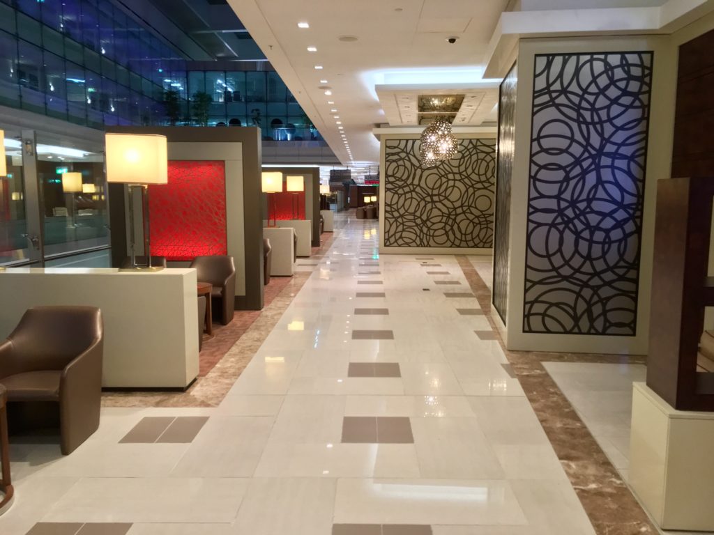 a hallway with a large glass wall