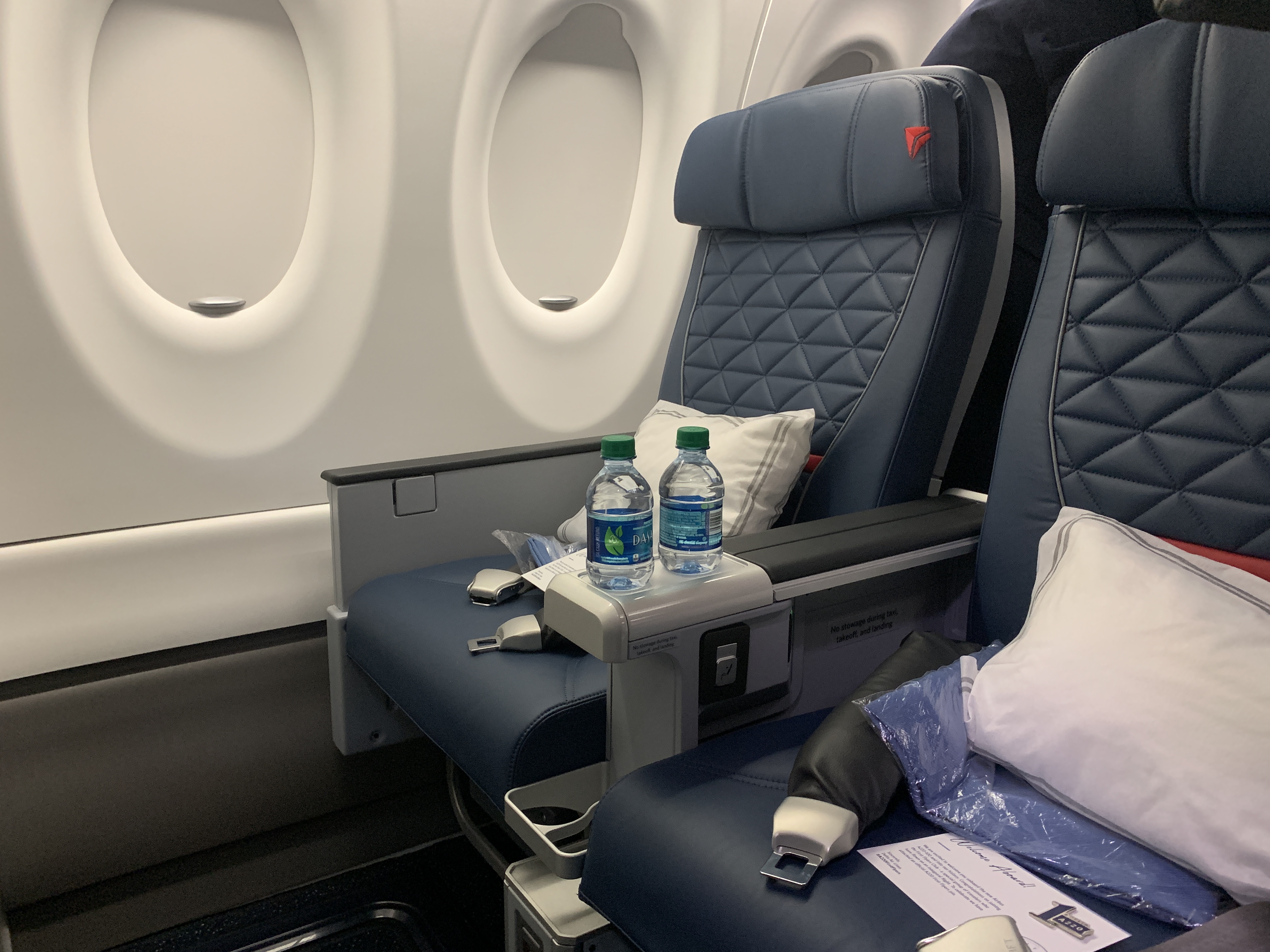 a seat with two bottles on the side