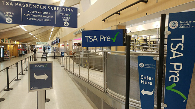 signs in a terminal with railings
