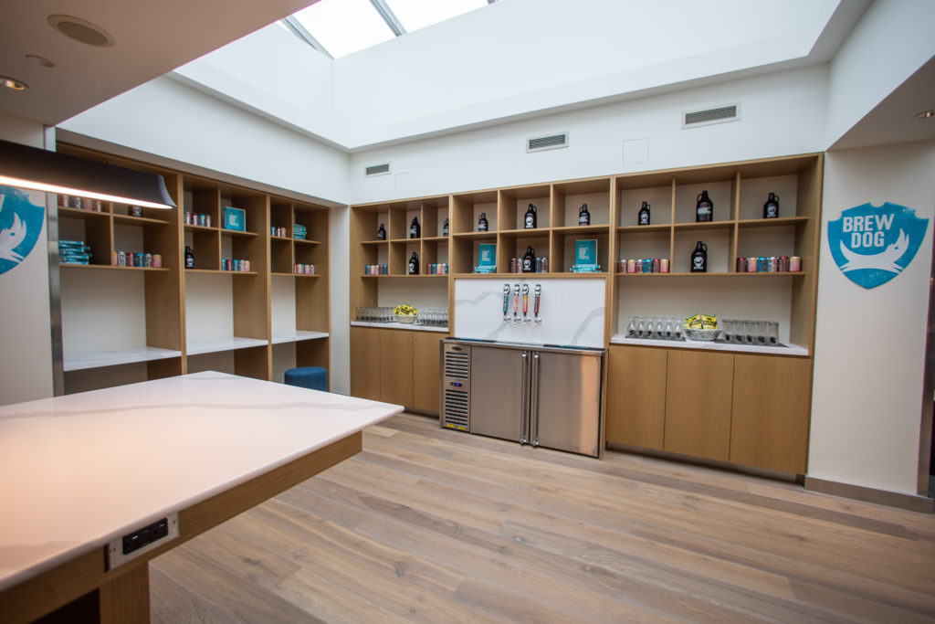 a room with shelves and shelves of liquor bottles