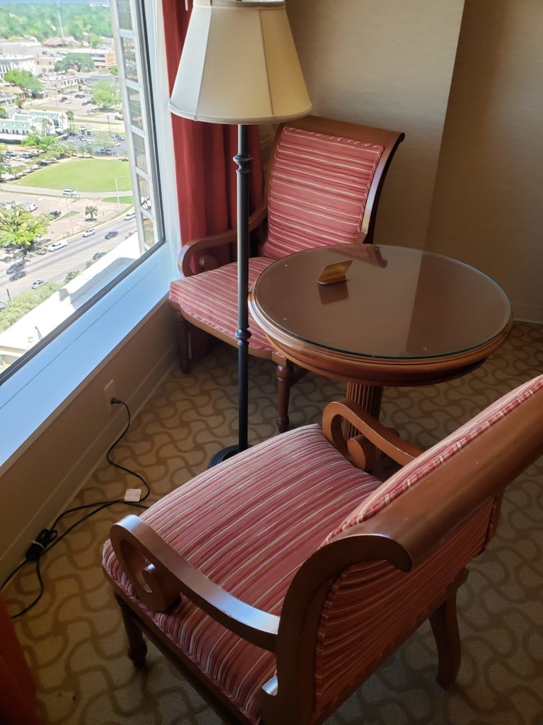 a chair and a lamp in a room