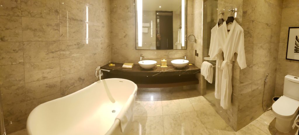 a bathroom with marble floor and marble countertop