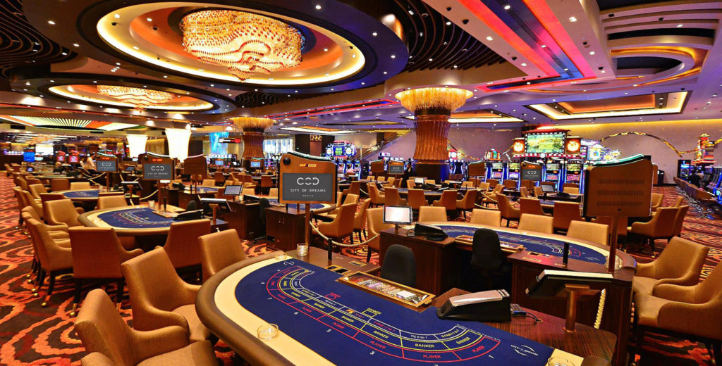 a large casino with tables and chairs