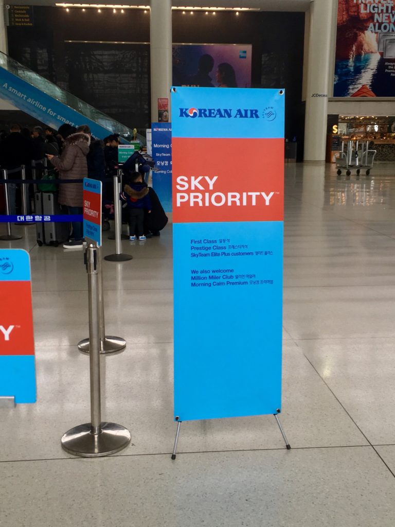 a blue and red sign in a airport