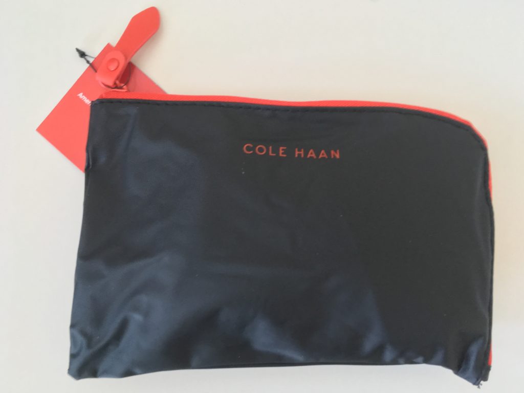 a black pouch with red zipper