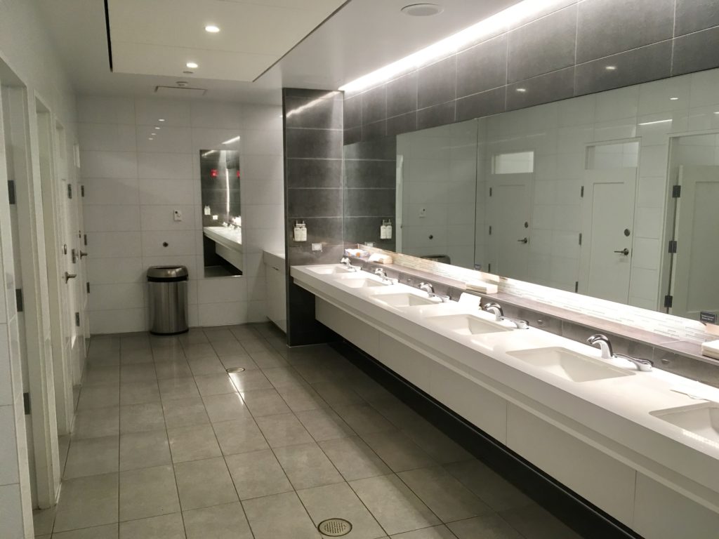 a bathroom with sinks and mirrors
