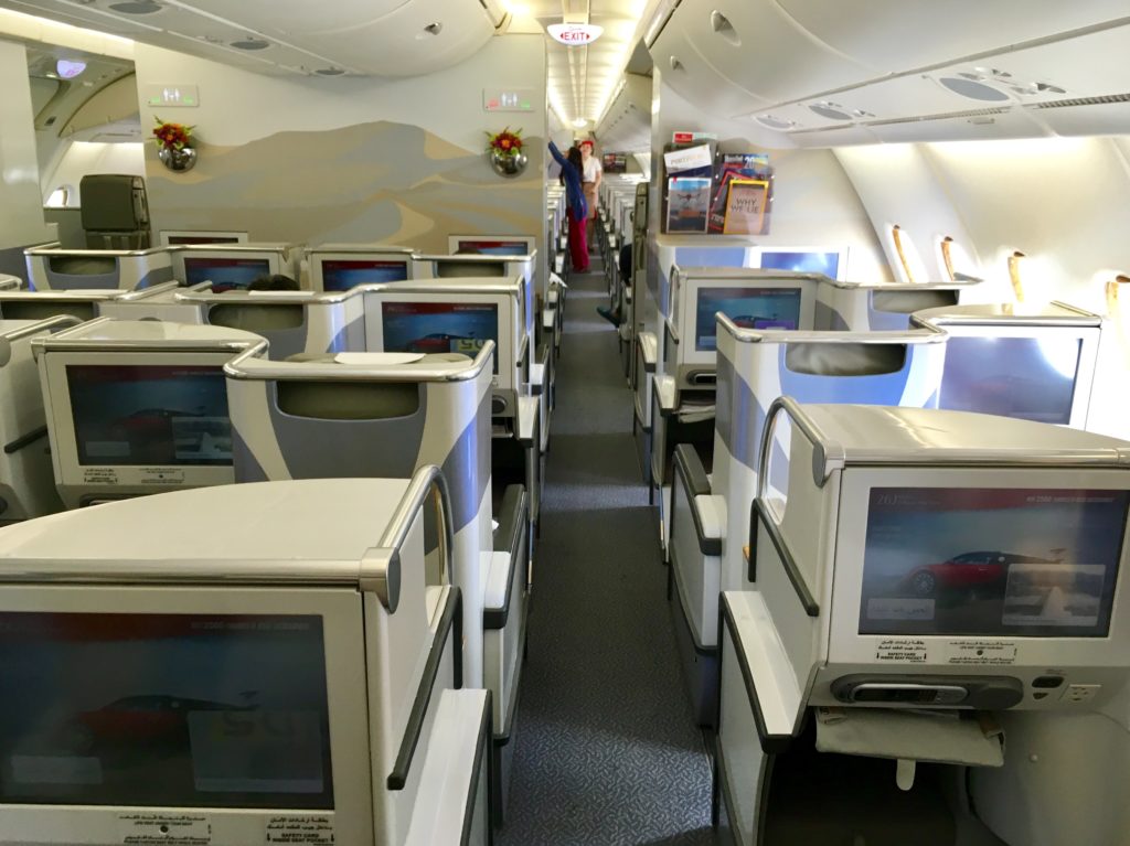 an airplane with seats and monitors