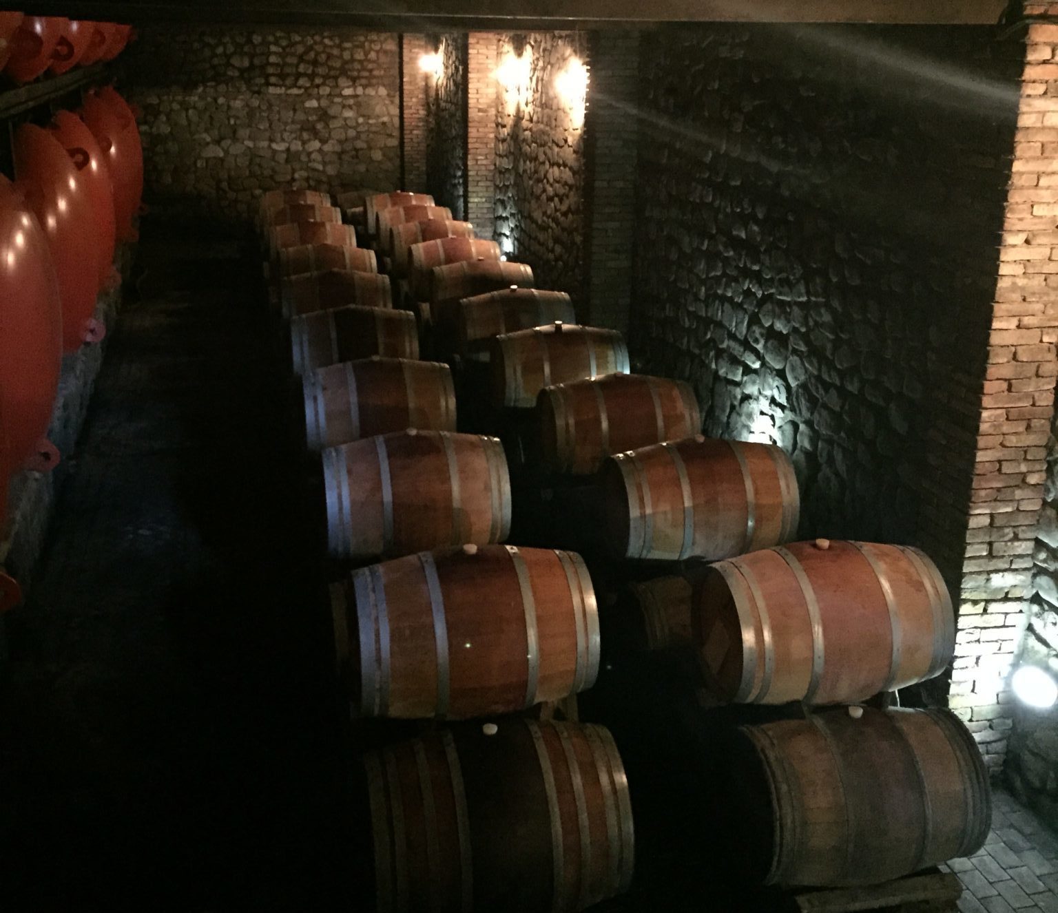 a group of barrels in a dark room