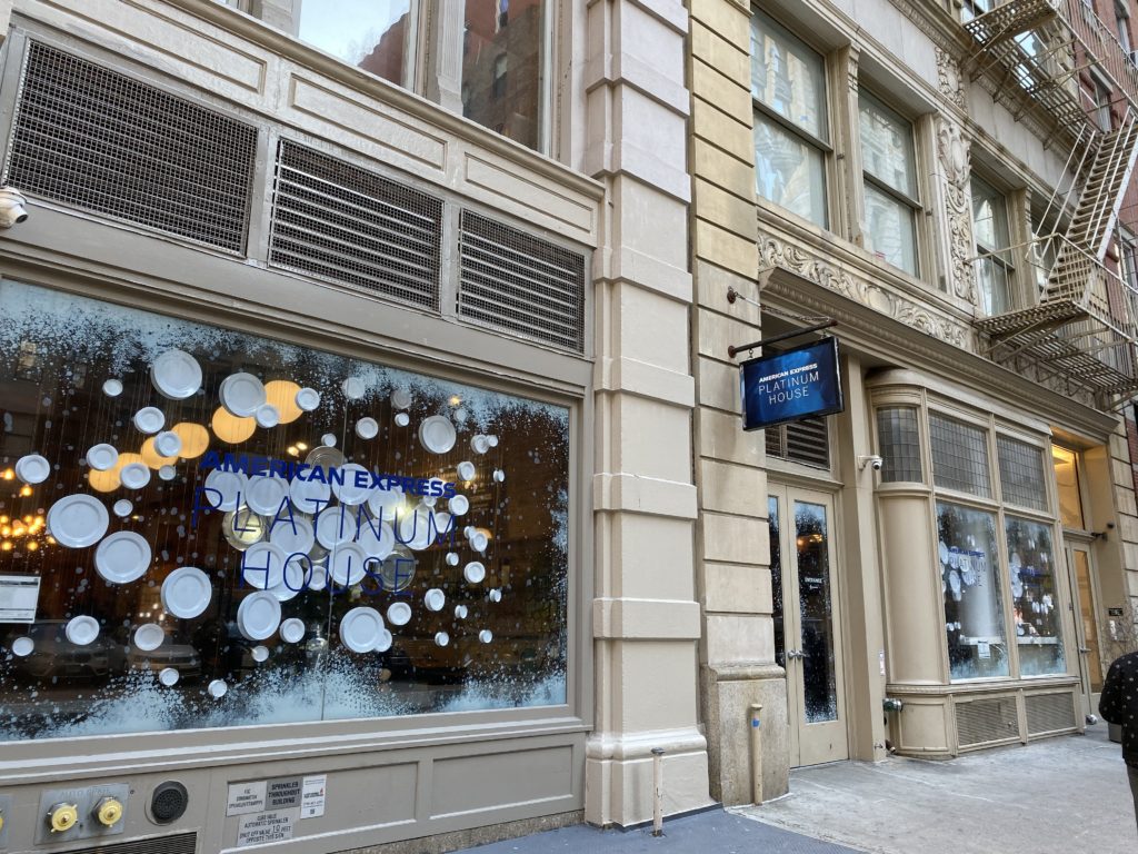 a storefront with a window with plates on it