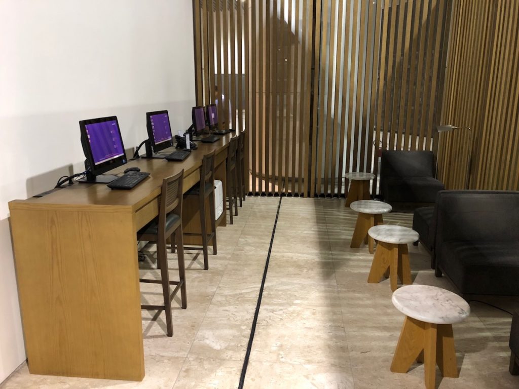 a room with a row of computers