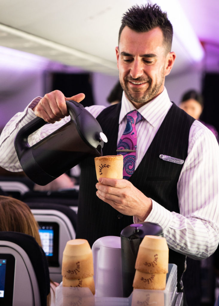 a man pouring coffee into a cup