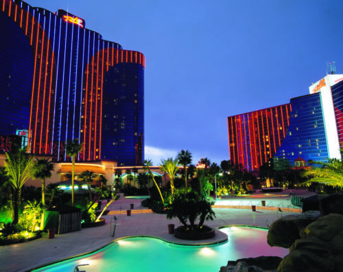 a pool in front of a hotel with Rio All Suite Hotel and Casino in the background