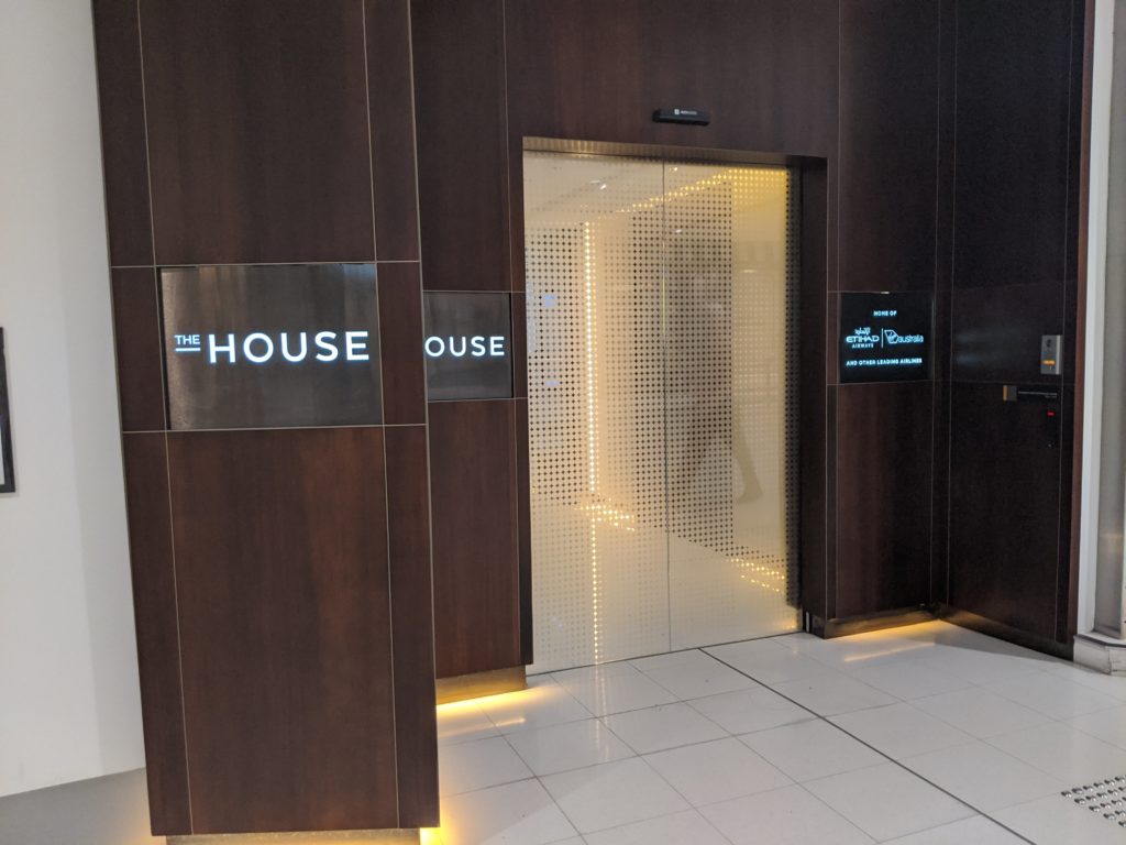 a elevator with a sign on the wall