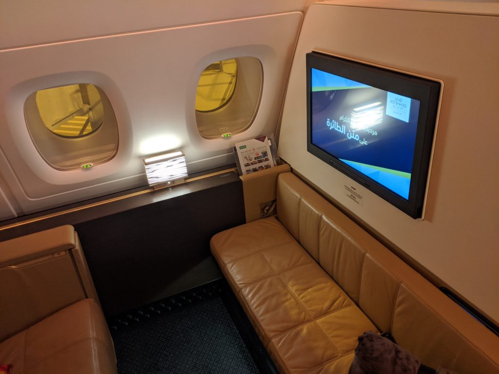 a tv on the wall of an airplane