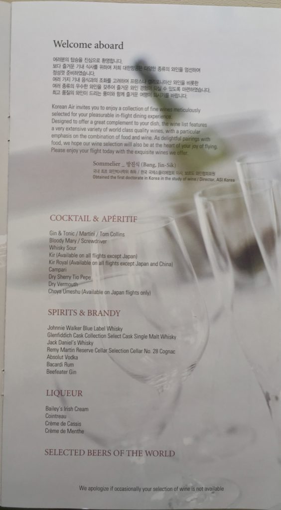 a menu with a few wine glasses