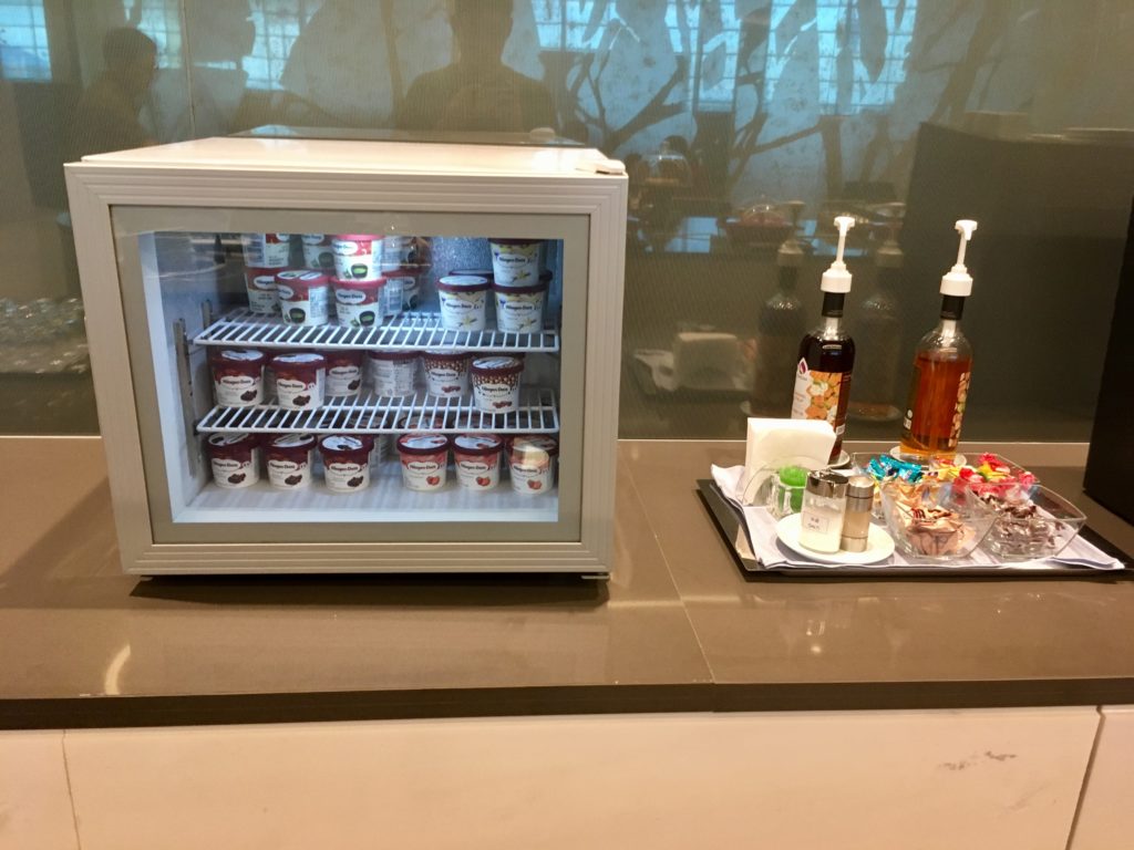 a small refrigerator with food on a tray