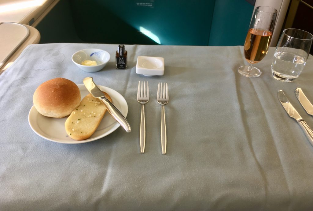 a plate with food on it and silverware on a table