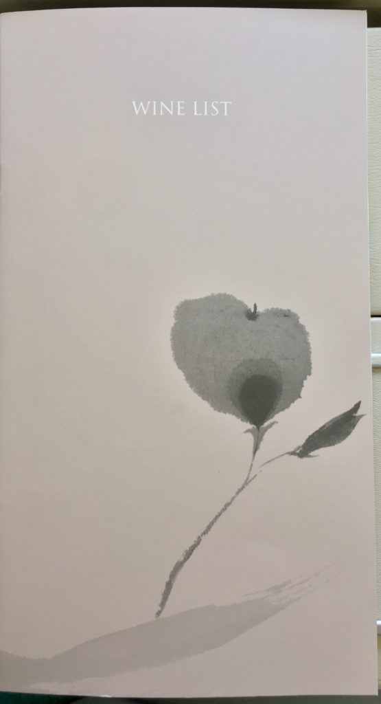 a white paper with a flower on it