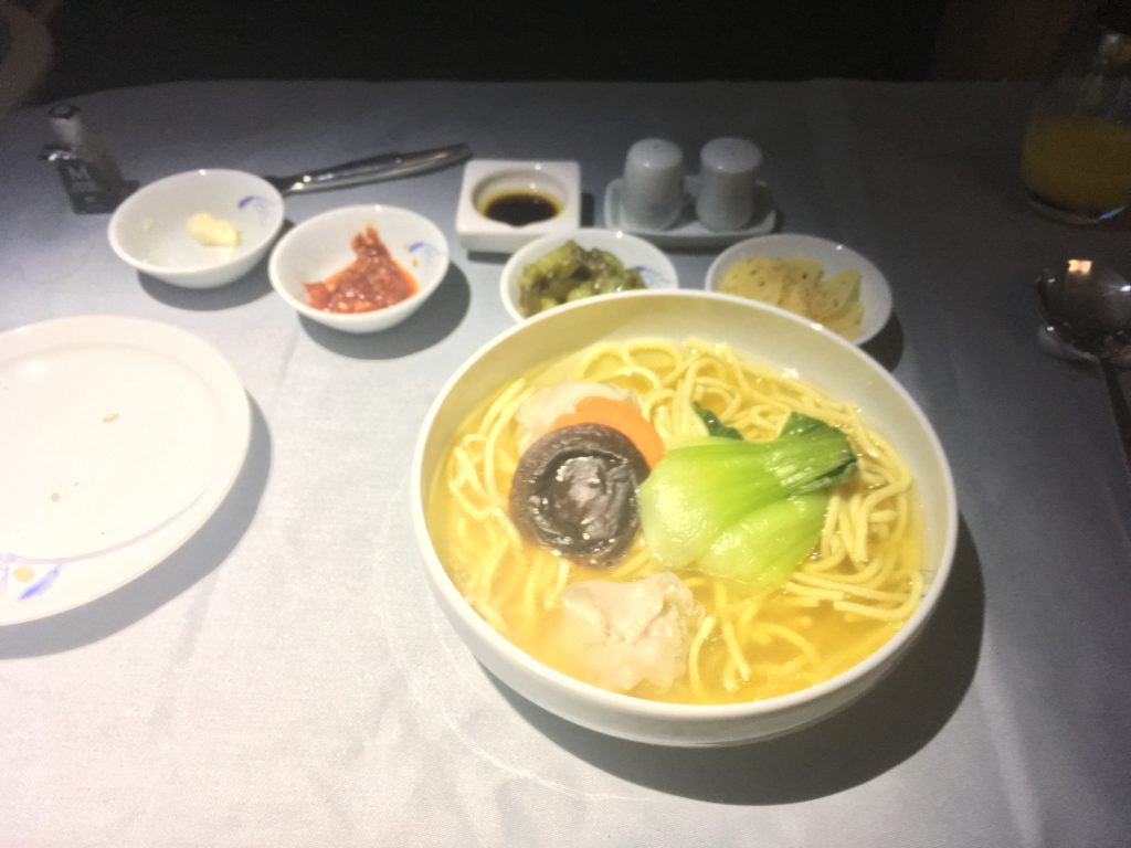a bowl of soup with noodles and vegetables