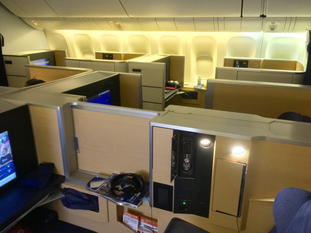 an airplane cabin with a few seats and a few desks