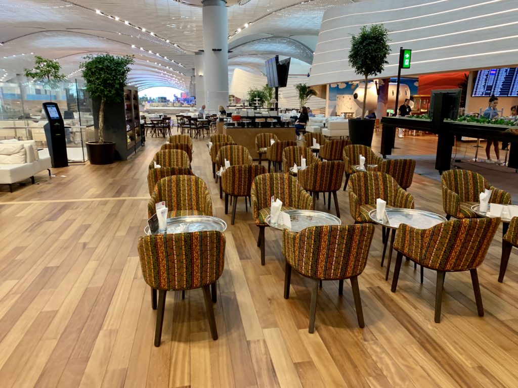 a group of chairs and tables in a restaurant
