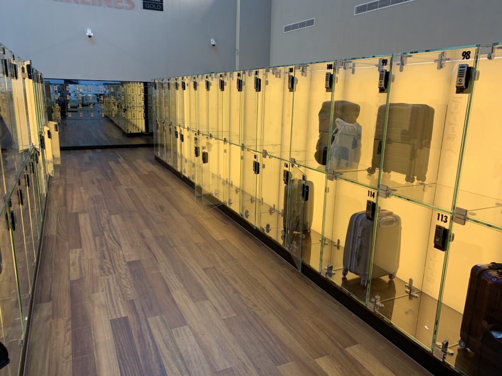 a glass case with luggage in it