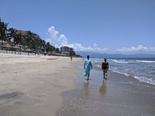 people walking on a beach