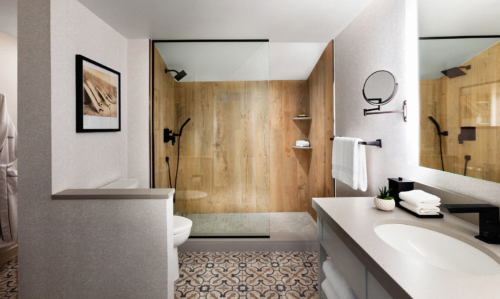 a bathroom with a wood paneled shower