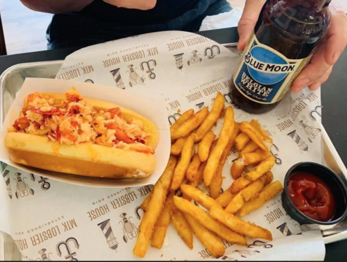 a hot dog and fries on a table
